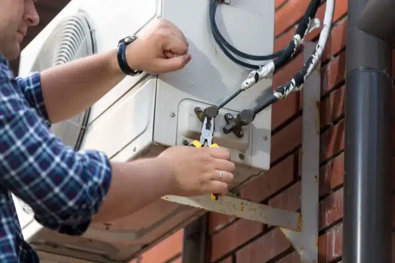 Closeup Of Male Technician Repairing Outdoor Air C 2021 12 09 17 34 31 Utc Scaled 1