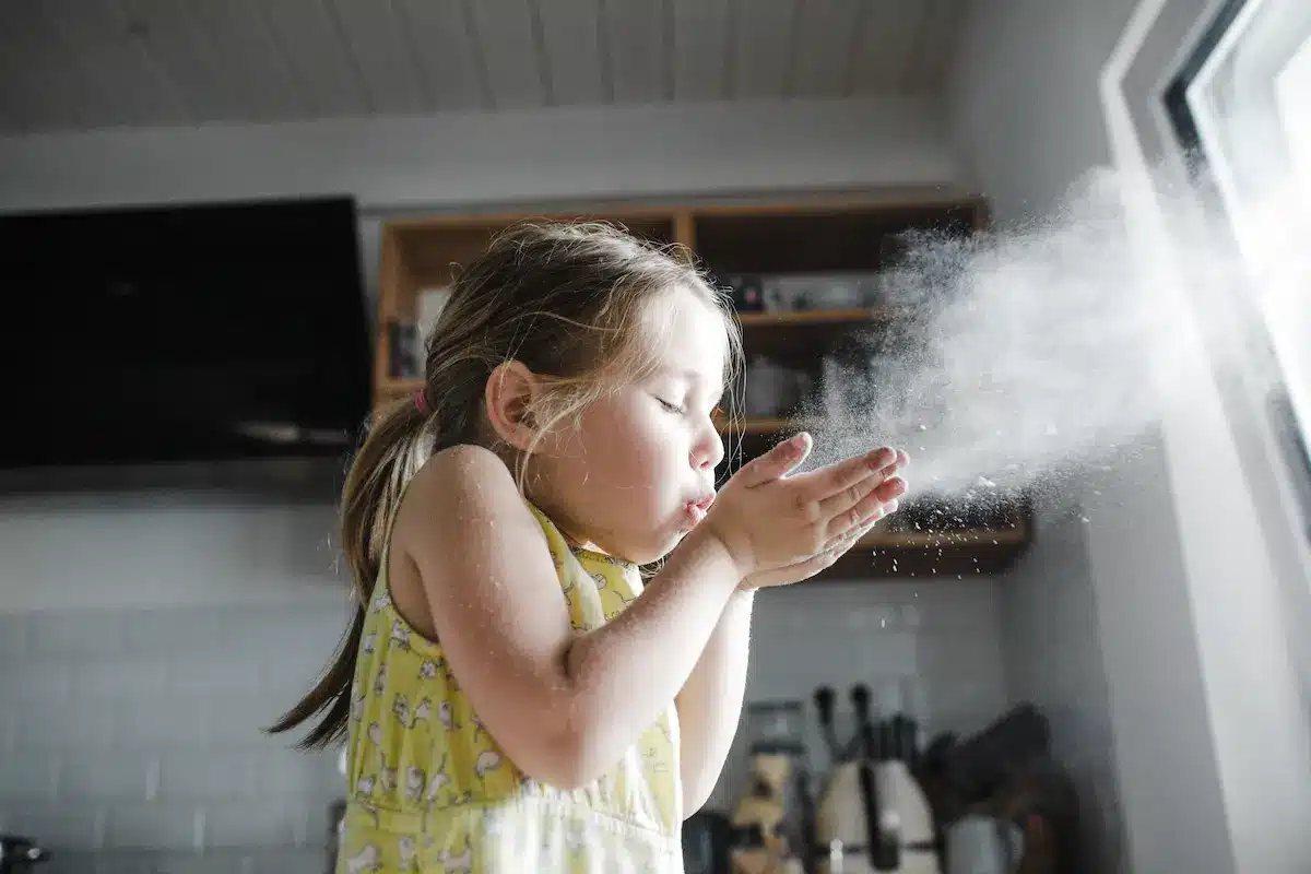 Little Girl Blowing Flour In The Air In The Kitche 2022 12 16 22 11 08 Utc