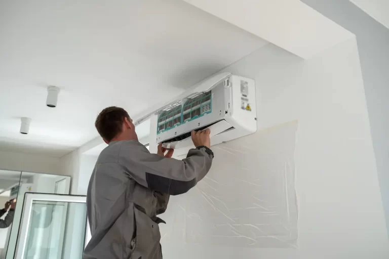 Male Worker Installing Air Conditioner In Apartmen 2023 06 26 22 30 09 Utc