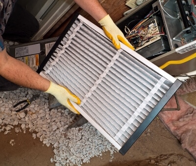 Technician Holding Air Filter